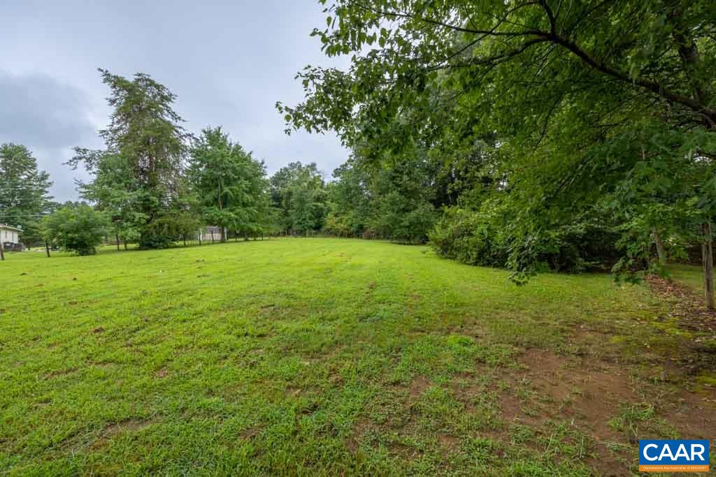 528 Matthew Mill Road Ruckersville, VA 22968 - Photo 26 of 27 a view of a grassy field with trees