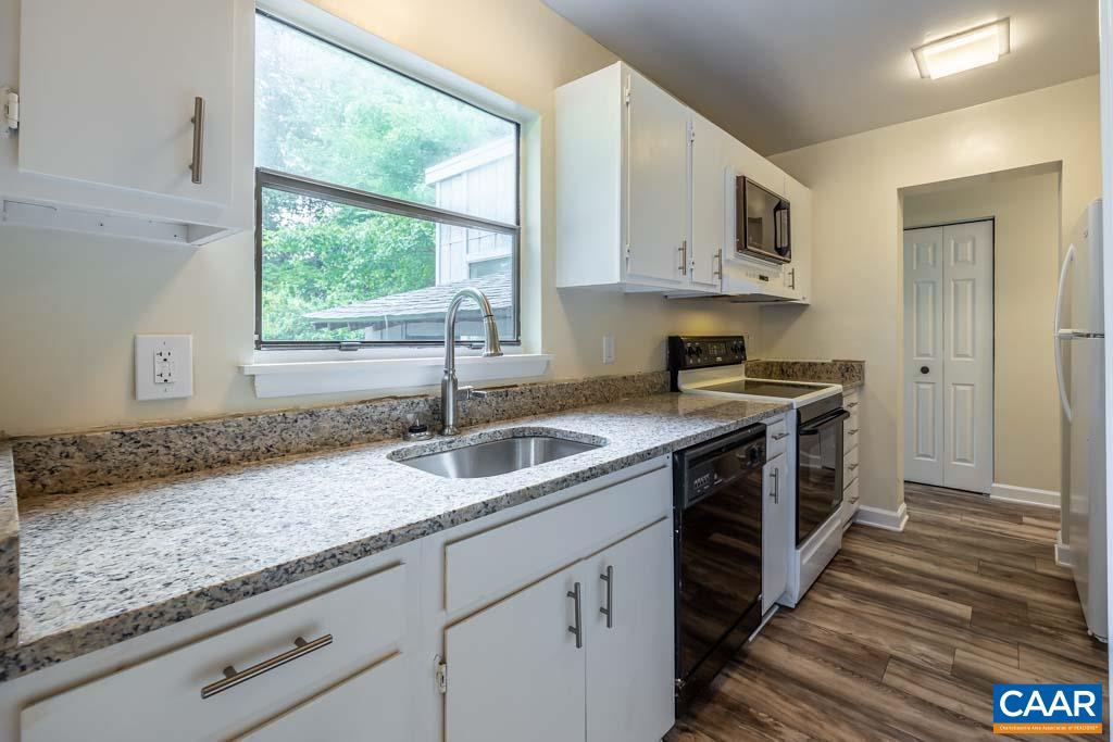 528 Matthew Mill Road Ruckersville, VA 22968 - Photo 3 of 27 a kitchen with granite countertop a sink and a stove