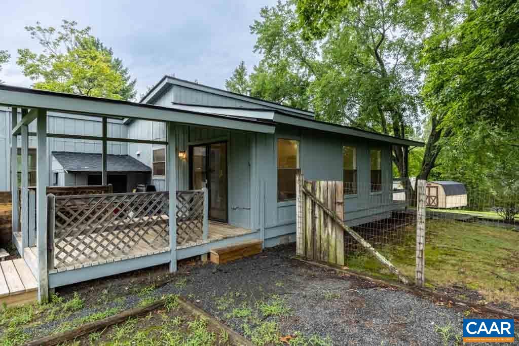528 Matthew Mill Road Ruckersville, VA 22968 - Photo 4 of 27 a view of house with a large window and wooden fence