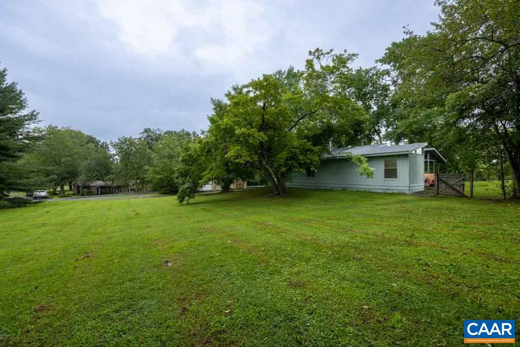 528 Matthew Mill Road Ruckersville, VA 22968 - Photo 5 of 27 a view of a house with a backyard