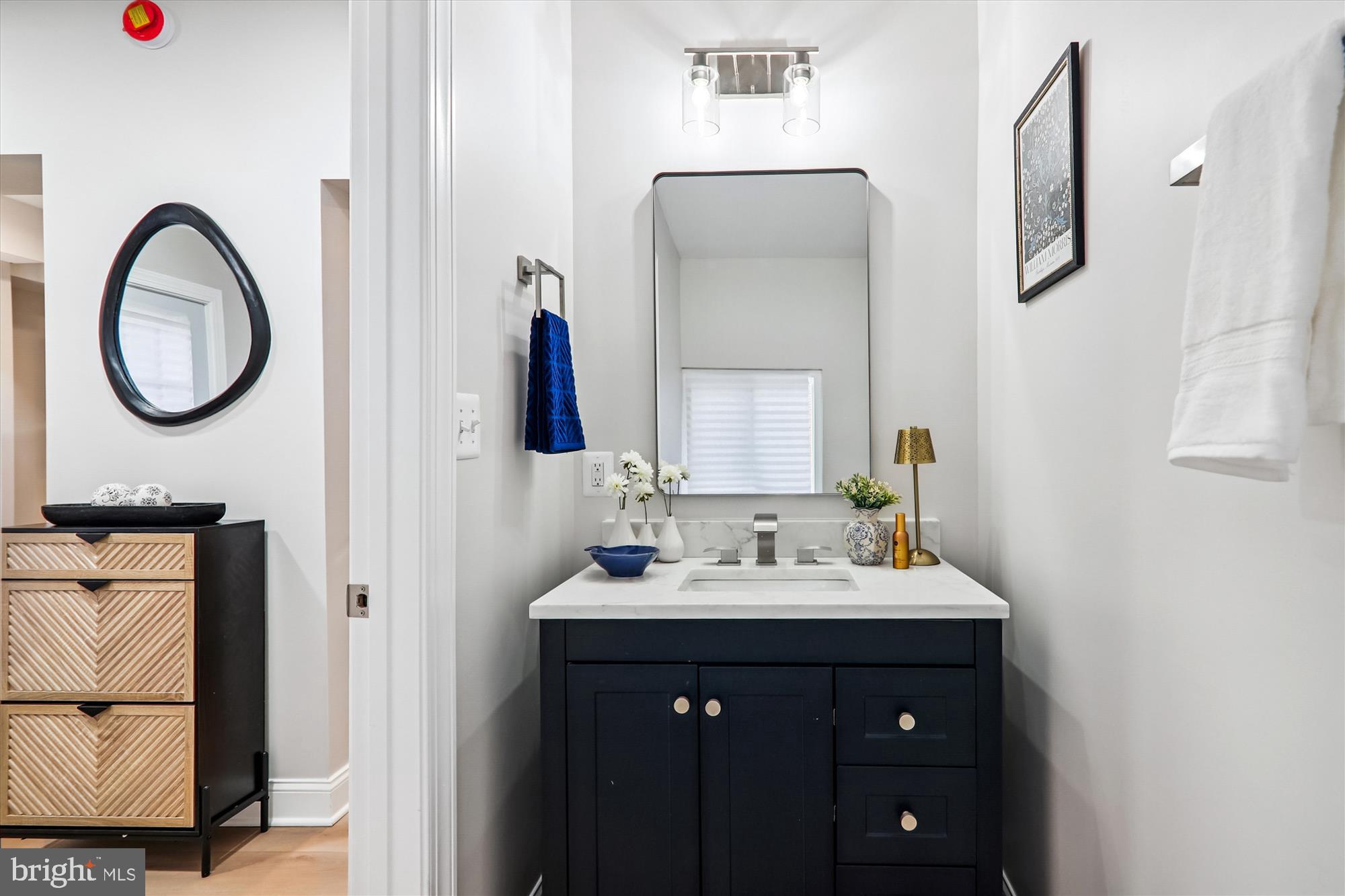 1374 Rittenhouse Street Northwest Washington, DC 20011 - Photo 11 of 30 a bathroom with a sink vanity and mirror
