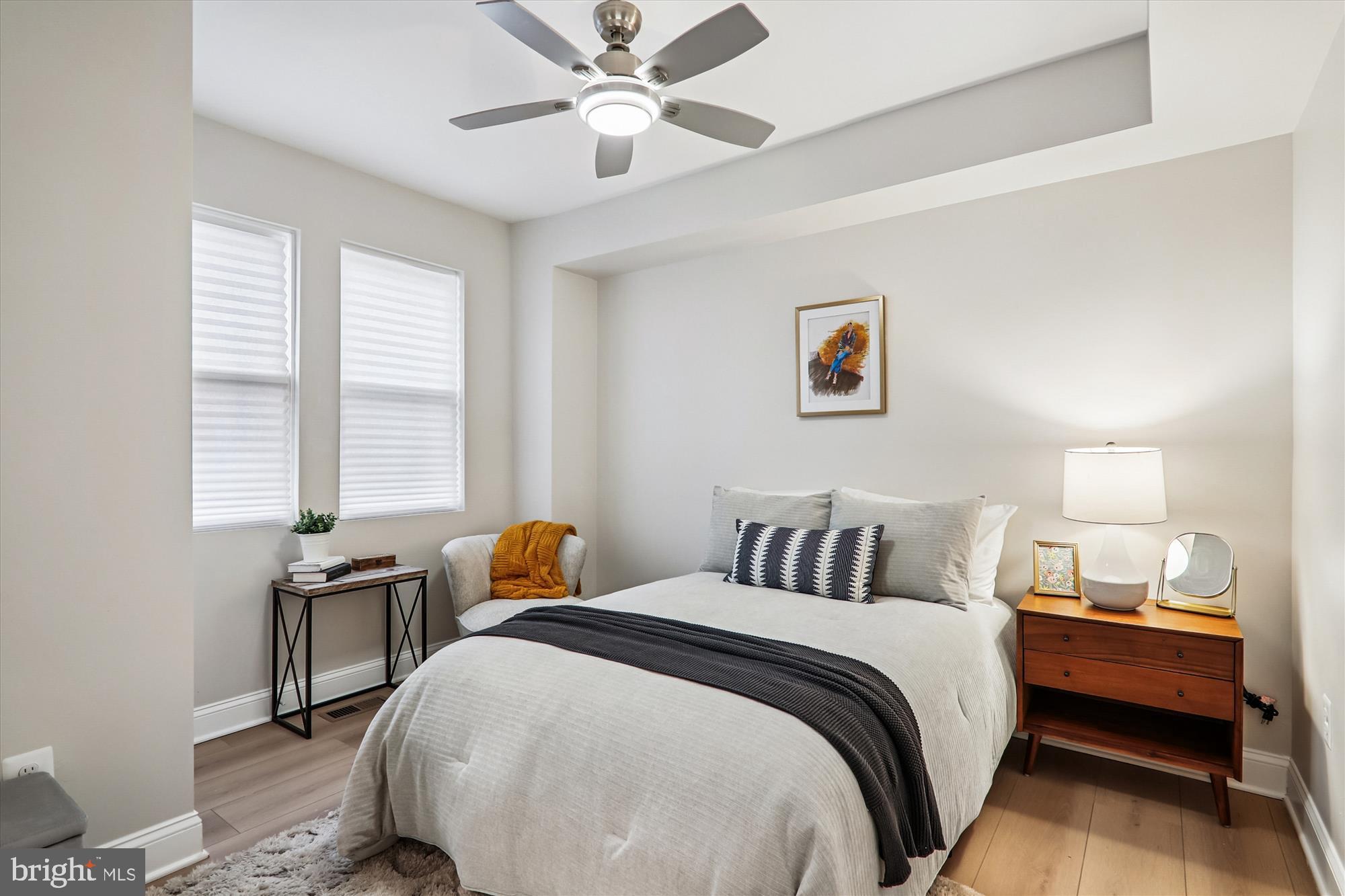 1374 Rittenhouse Street Northwest Washington, DC 20011 - Photo 12 of 30 a bedroom with a bed and wooden floor