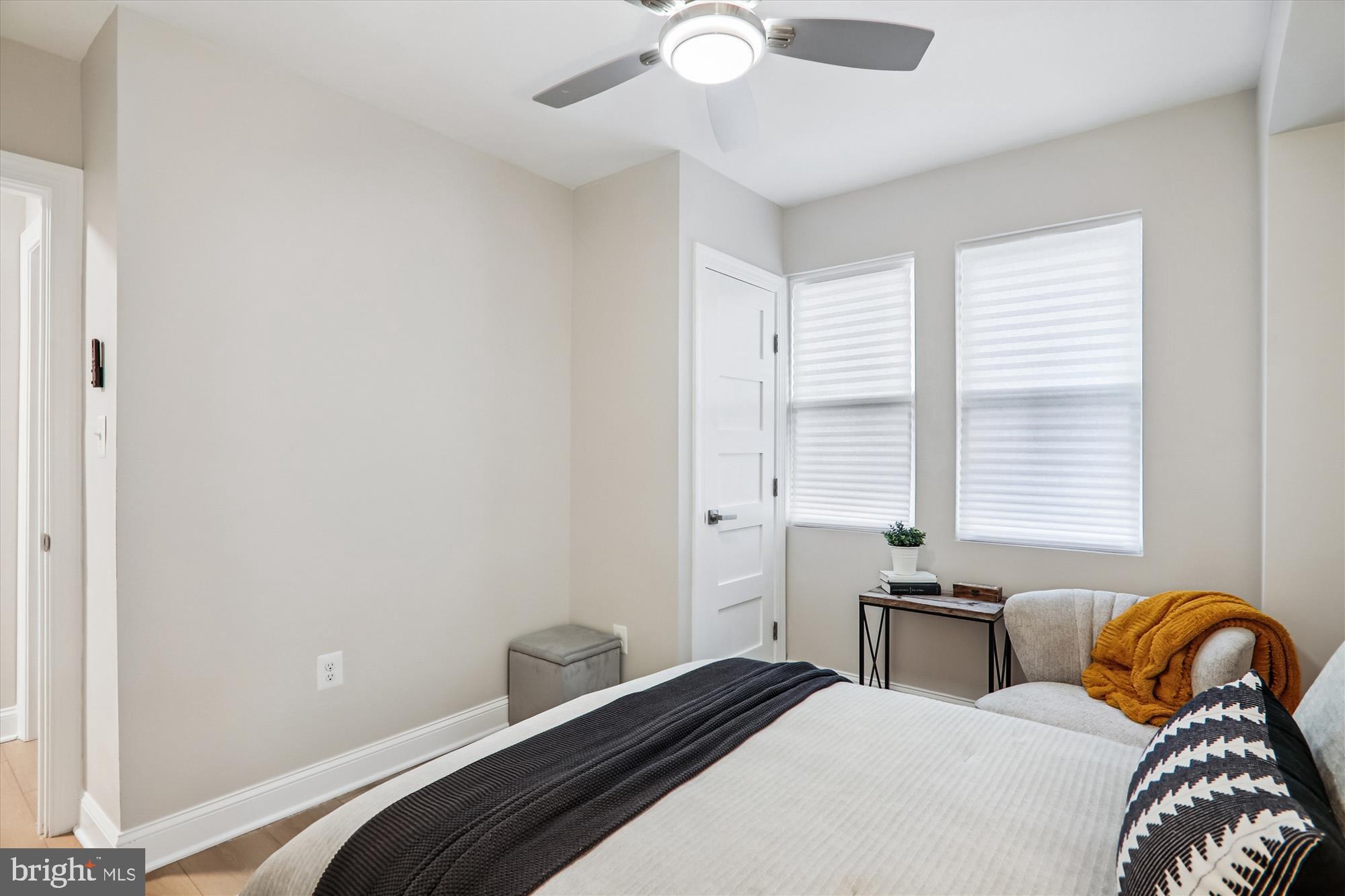 1374 Rittenhouse Street Northwest Washington, DC 20011 - Photo 13 of 30 a bedroom with a bed and a large window