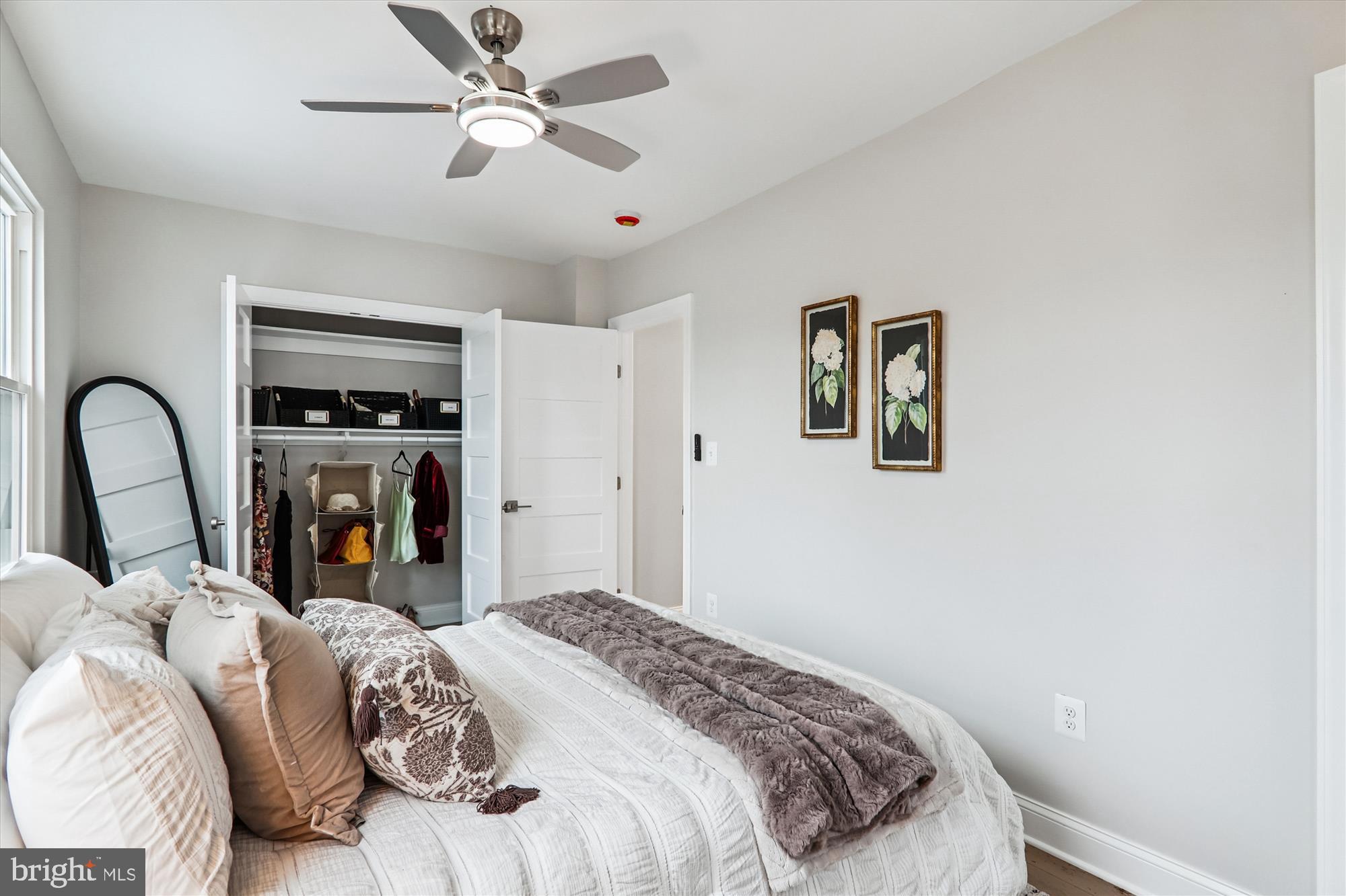 1374 Rittenhouse Street Northwest Washington, DC 20011 - Photo 20 of 30 a bedroom with a bed next to a window and a flat screen tv
