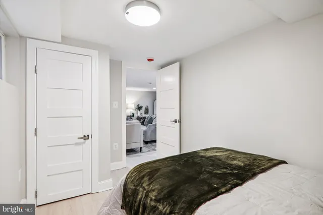 a bedroom with a bed and closet