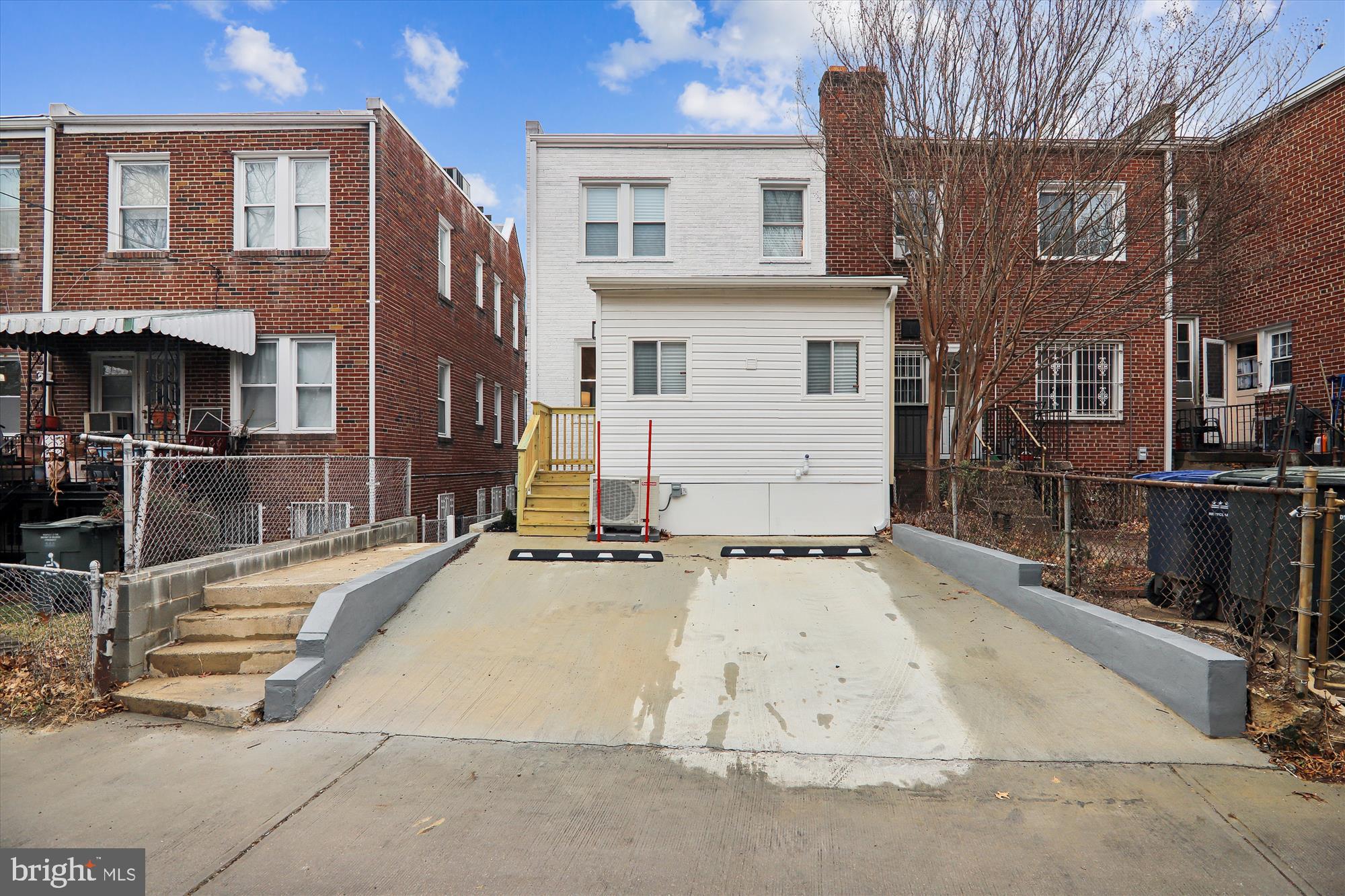 1374 Rittenhouse Street Northwest Washington, DC 20011 - Photo 30 of 30 a view of a white apartments with large windows