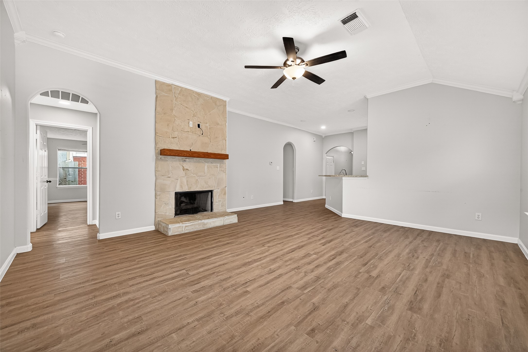 5517 Autumn Ash Lane Rosharon, TX 77583 - Photo 12 of 50 a view of a livingroom with wooden floors and fireplace