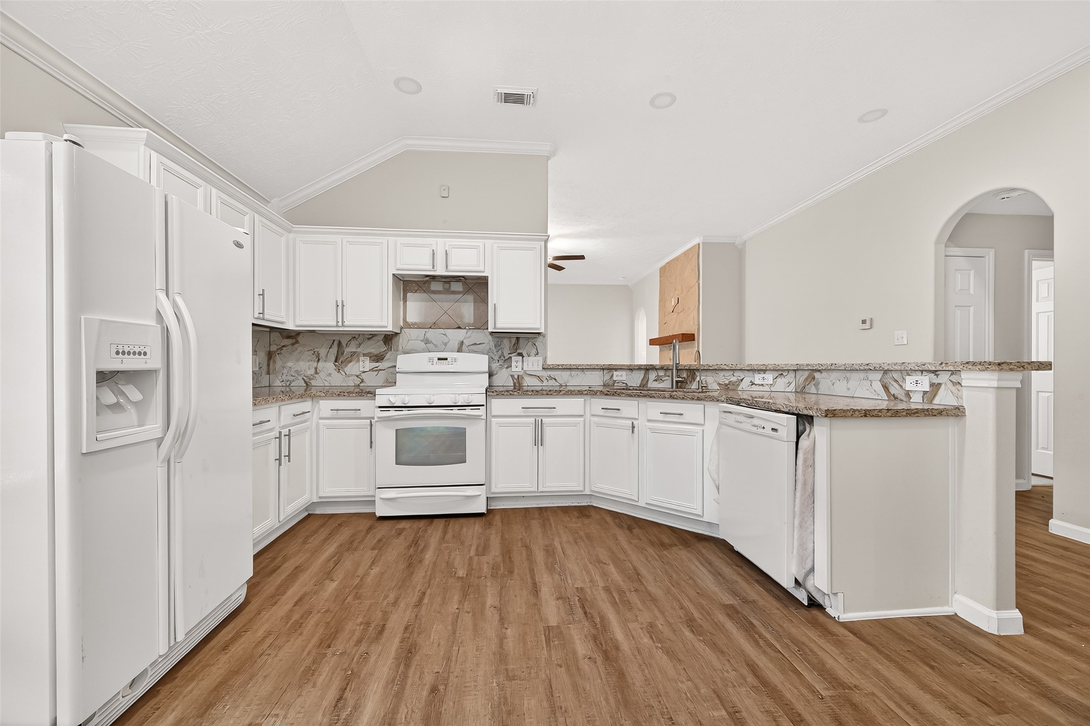 5517 Autumn Ash Lane Rosharon, TX 77583 - Photo 16 of 50 a kitchen with white cabinets and white appliances