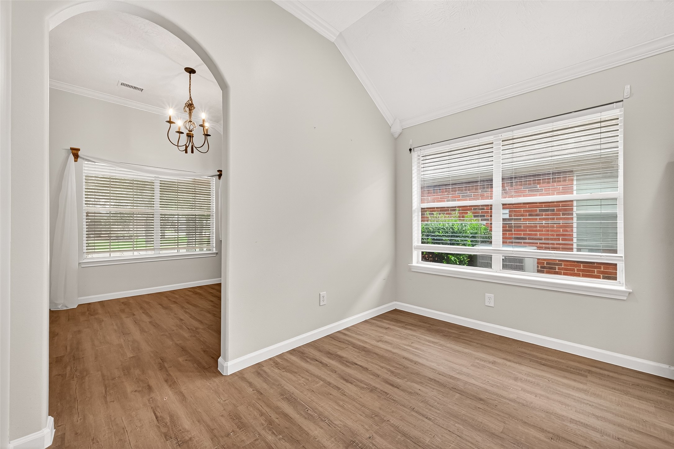 5517 Autumn Ash Lane Rosharon, TX 77583 - Photo 18 of 50 an empty room with wooden floor and windows