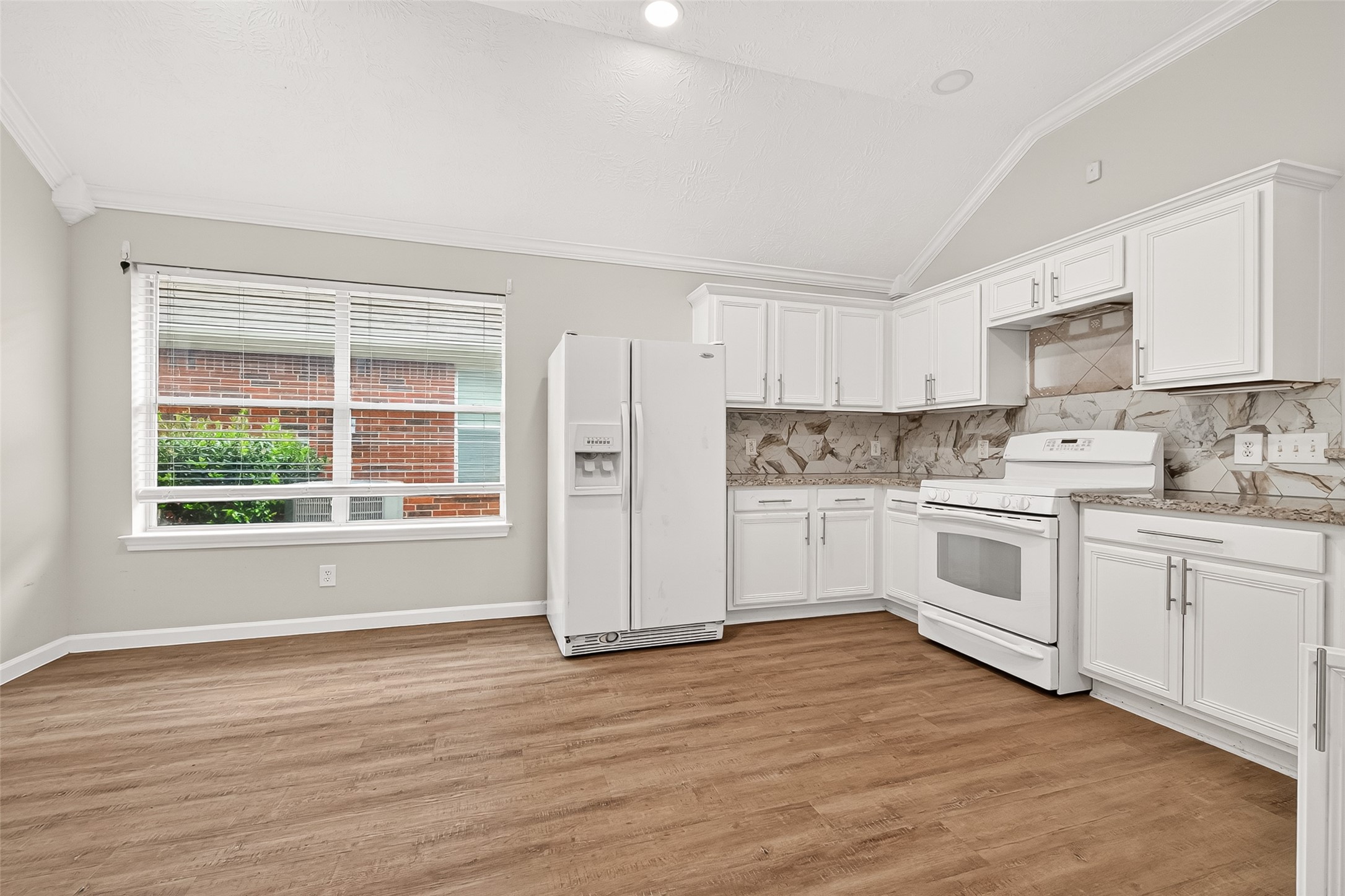 5517 Autumn Ash Lane Rosharon, TX 77583 - Photo 20 of 50 a kitchen with stainless steel appliances a white stove top oven sink and cabinets