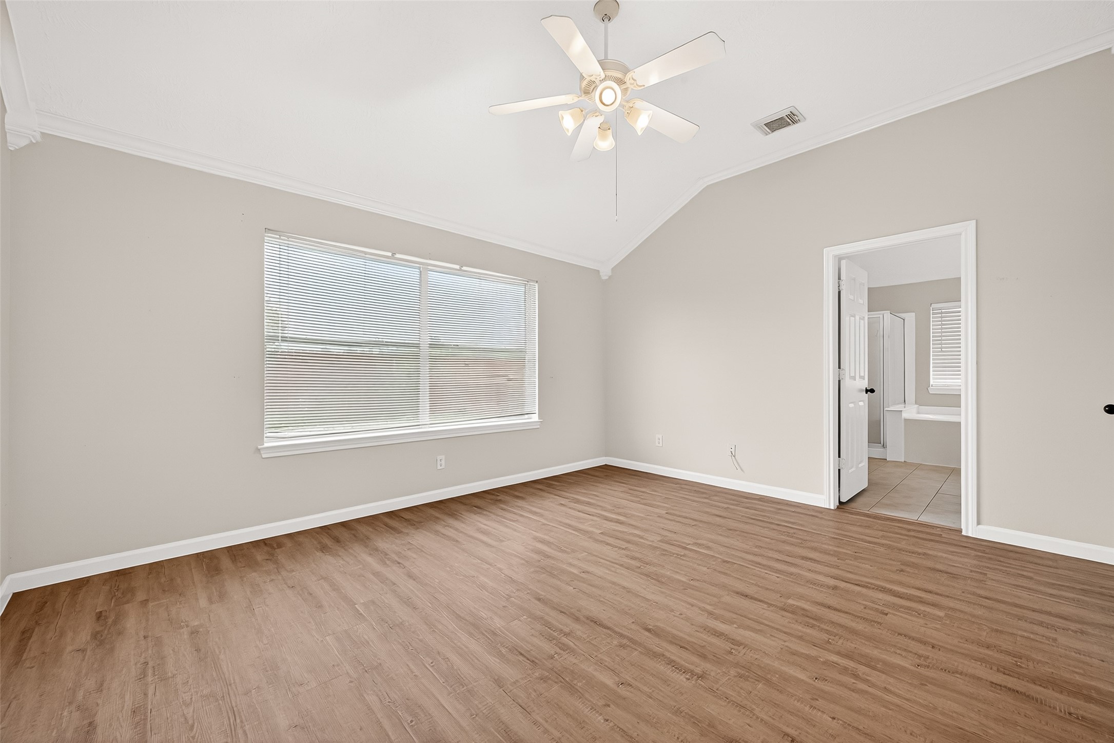 5517 Autumn Ash Lane Rosharon, TX 77583 - Photo 24 of 50 an empty room with wooden floor chandelier fan and windows