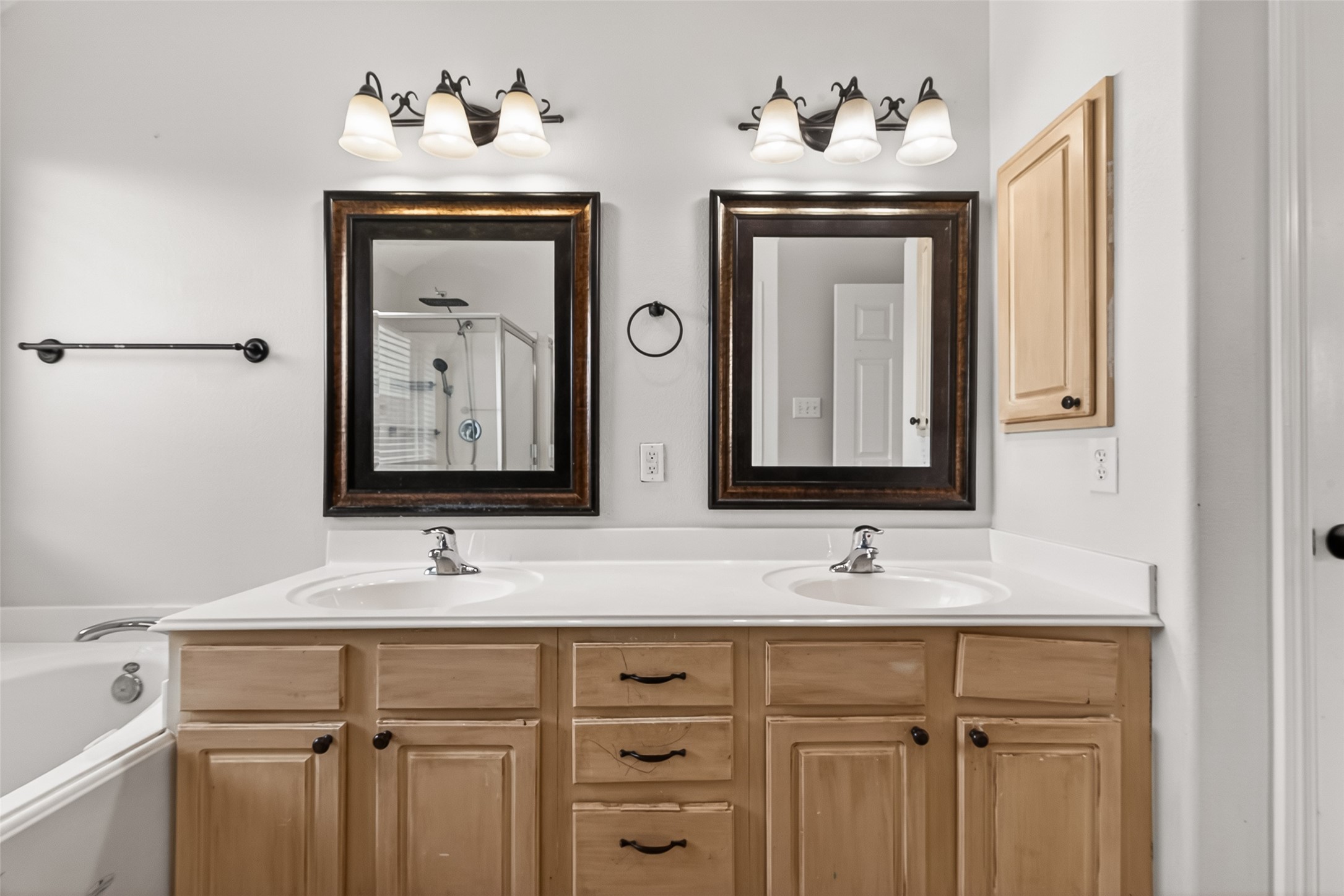 5517 Autumn Ash Lane Rosharon, TX 77583 - Photo 28 of 50 a bathroom with a double vanity sink and a mirror