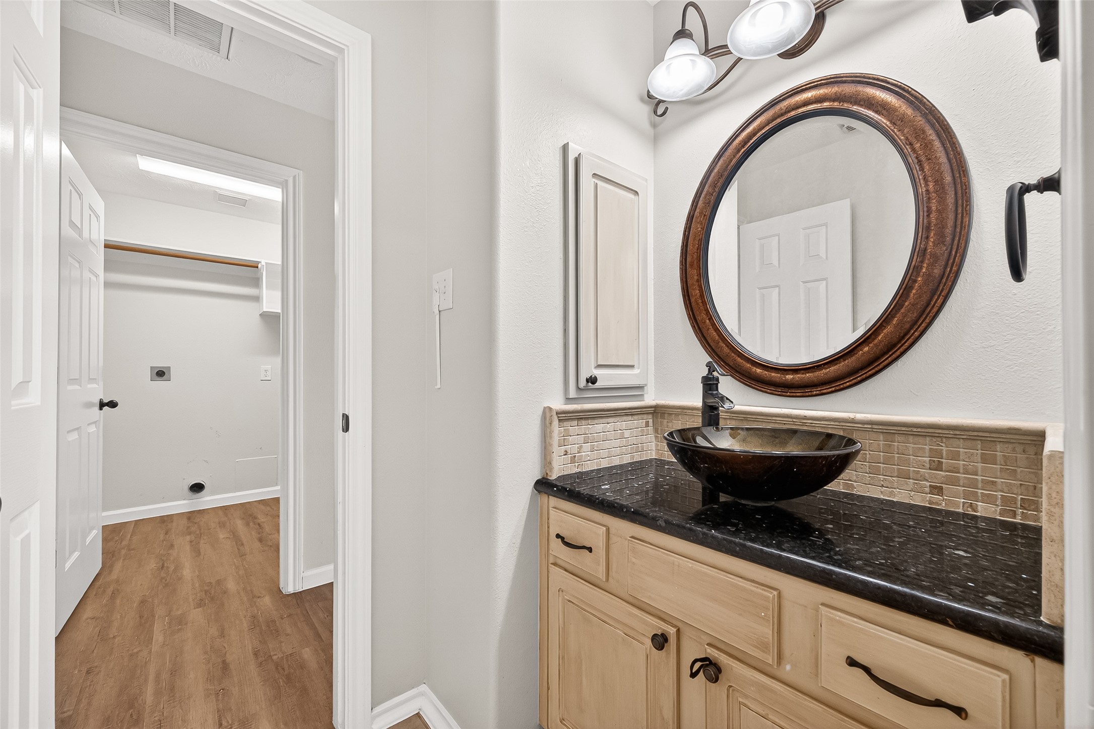 5517 Autumn Ash Lane Rosharon, TX 77583 - Photo 39 of 50 a bathroom with a granite countertop sink and a mirror