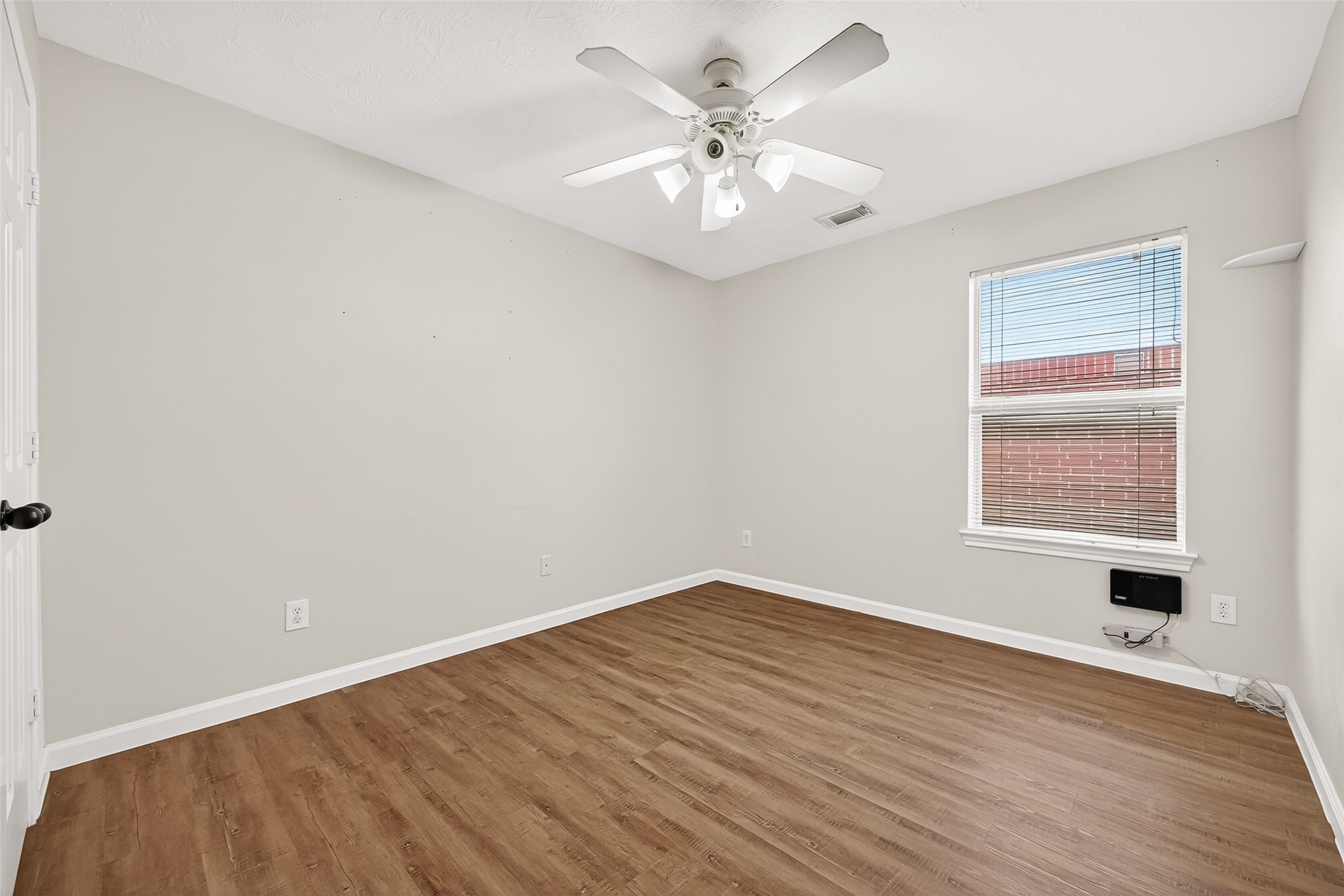 5517 Autumn Ash Lane Rosharon, TX 77583 - Photo 43 of 50 wooden floor in an empty room with a window