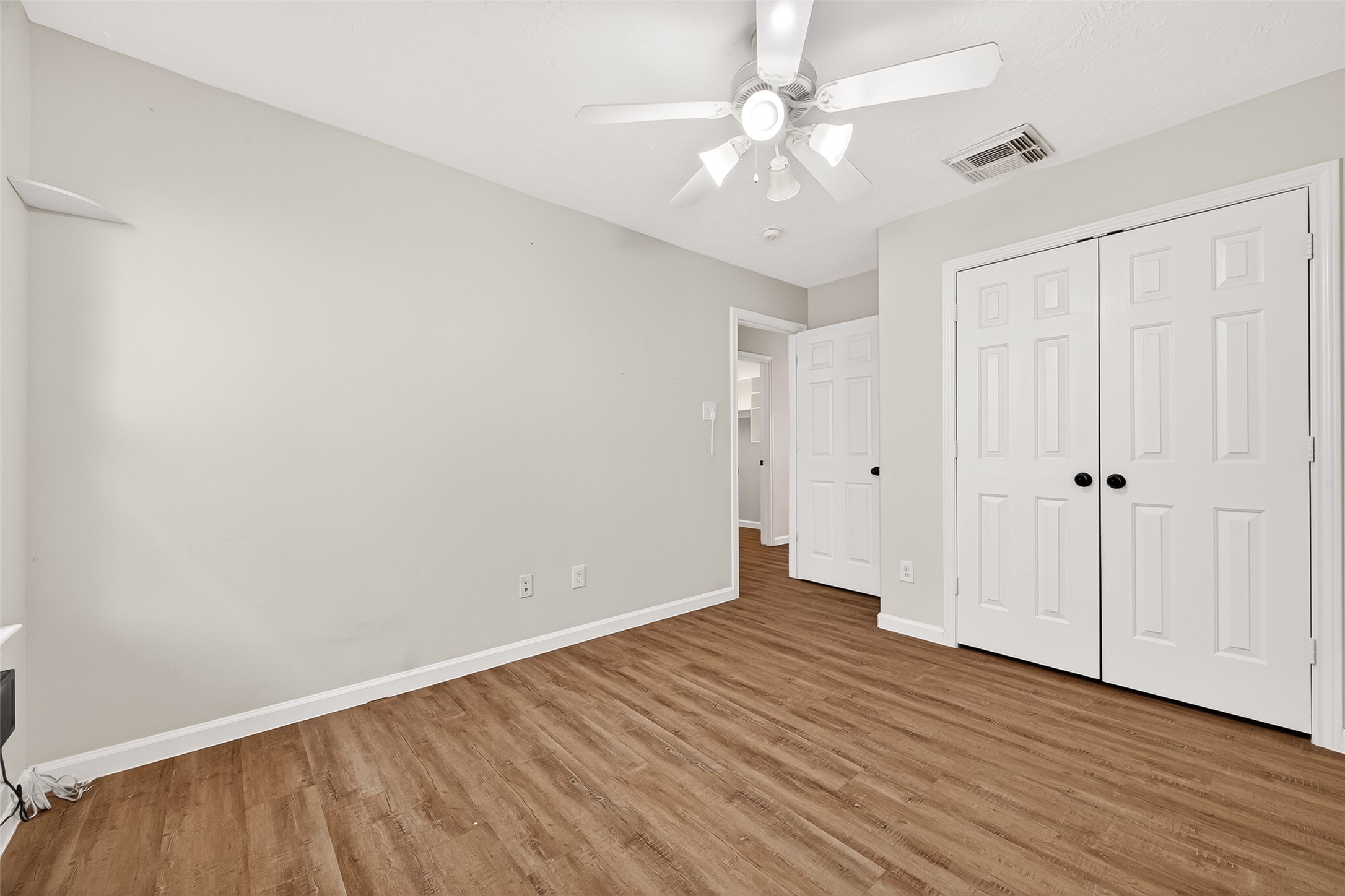 5517 Autumn Ash Lane Rosharon, TX 77583 - Photo 44 of 50 a view of an empty room with wooden floor