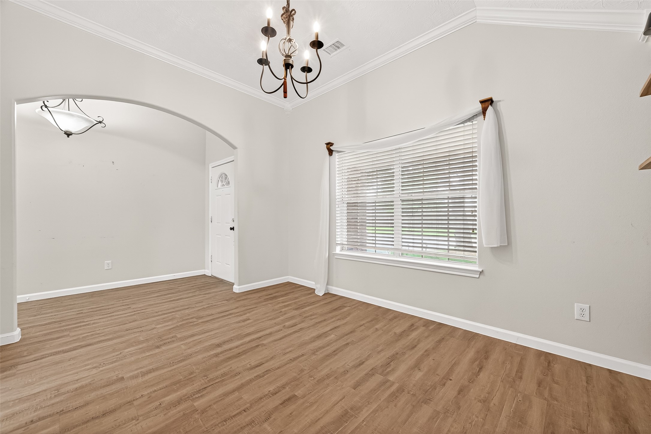 5517 Autumn Ash Lane Rosharon, TX 77583 - Photo 9 of 50 a view of an empty room with a window and wooden floor