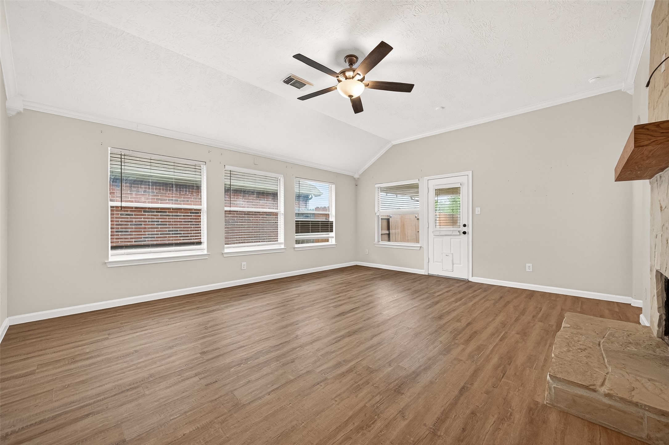 5517 Autumn Ash Lane Rosharon, TX 77583 - Photo 10 of 50 a view of an empty room with wooden floor and a window