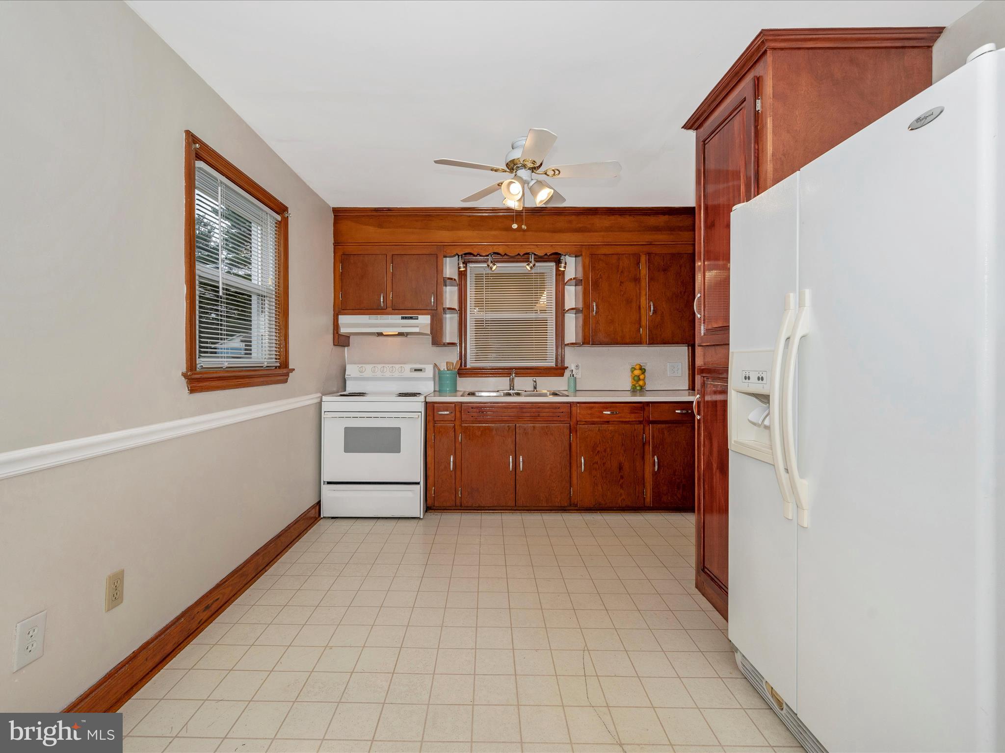 137 Devonshire Road Hagerstown, MD 21740 - Photo 7 of 41 a kitchen with stainless steel appliances a sink and a refrigerator