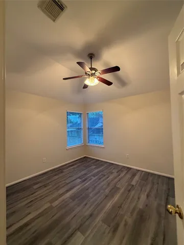 a white kitchen with granite countertop stainless steel appliances