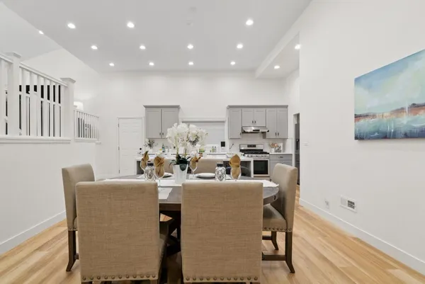 a dining room with furniture and a window