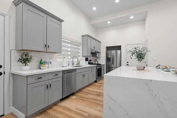 a kitchen with a sink and cabinets