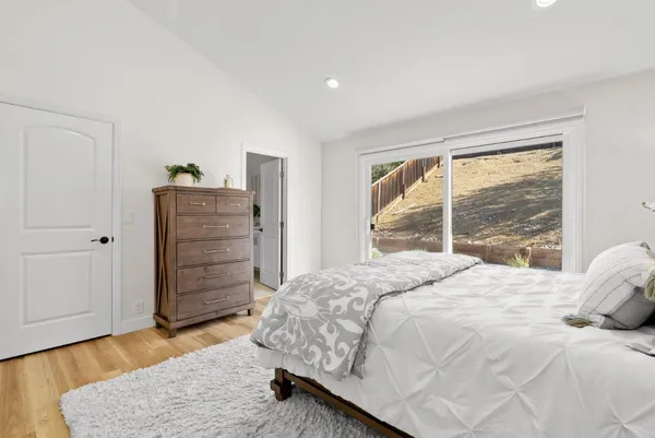 a bedroom with a bed and a dresser