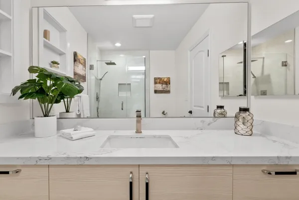 a bathroom with sink and mirror