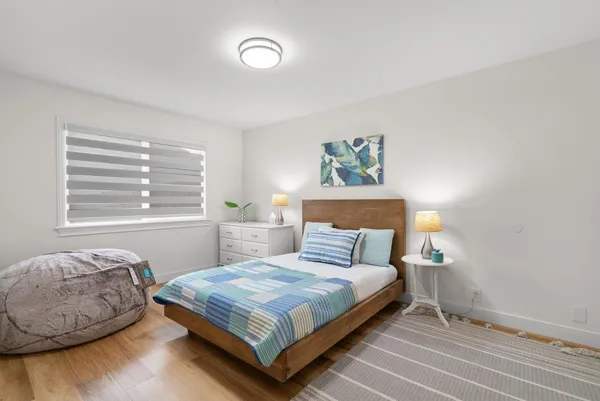 a bedroom with a bed and window