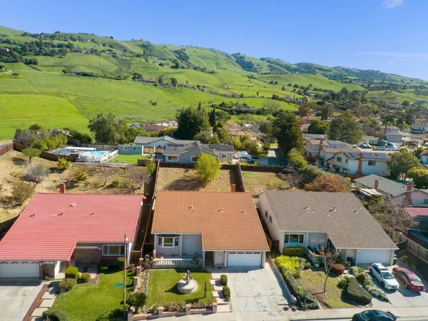 an aerial view of a houses with outdoor space