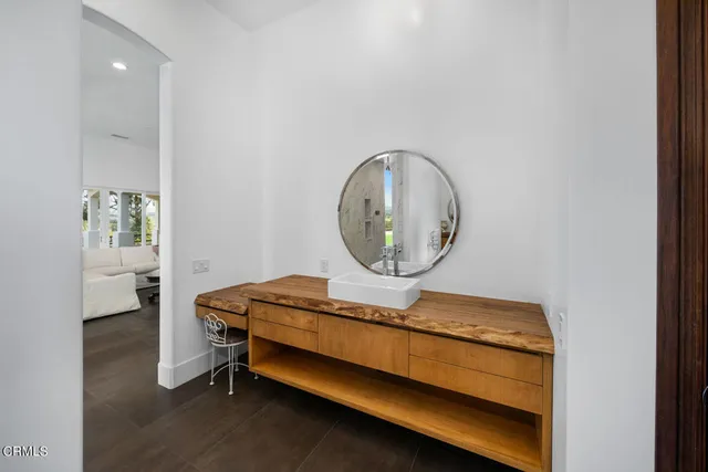 a room with furniture and a mirror