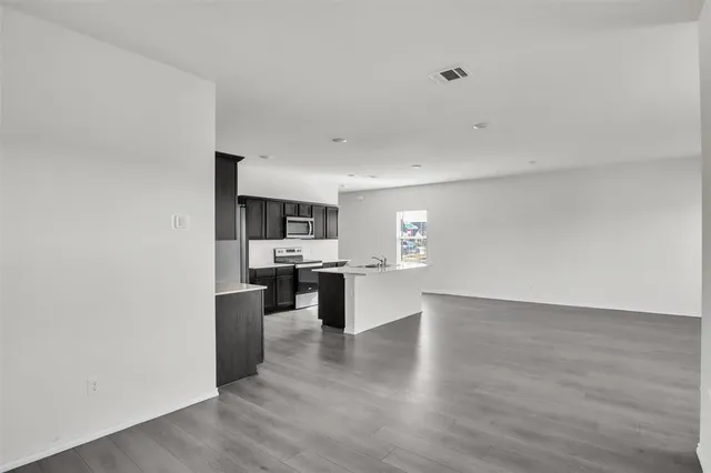 a view of kitchen with wooden floor