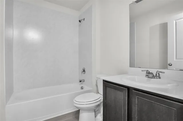 a bathroom with a sink toilet and bathtub