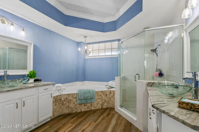 a bedroom with two beds and a large window