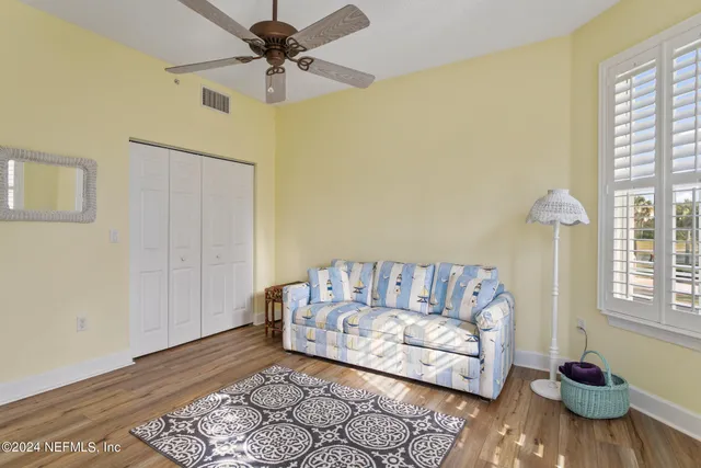 a view of a lake with houses in the back