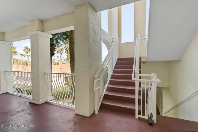 a kitchen with stainless steel appliances granite countertop a refrigerator and a stove