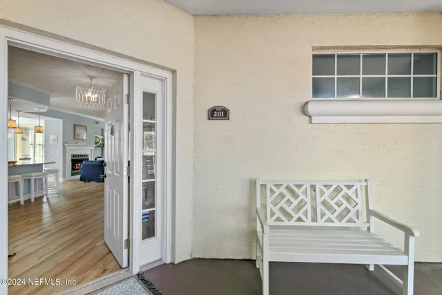 a view of a dining room with furniture window and chandelier