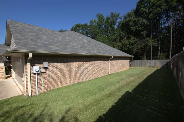 a aerial view of a house with a yard