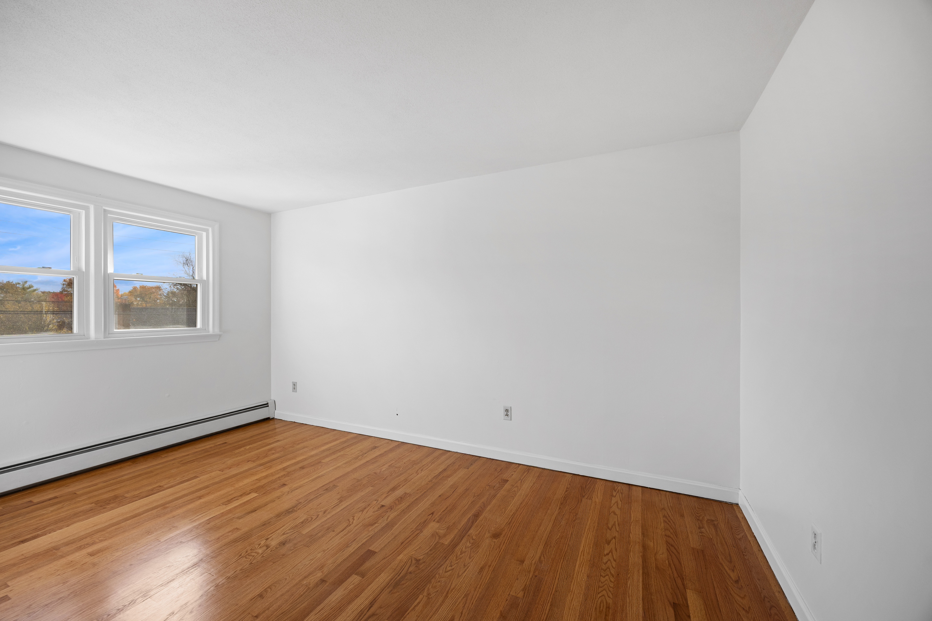 19 Albert Avenue Wethersfield, CT 06109 - Photo 14 of 32 a view of an empty room with wooden floor and a window