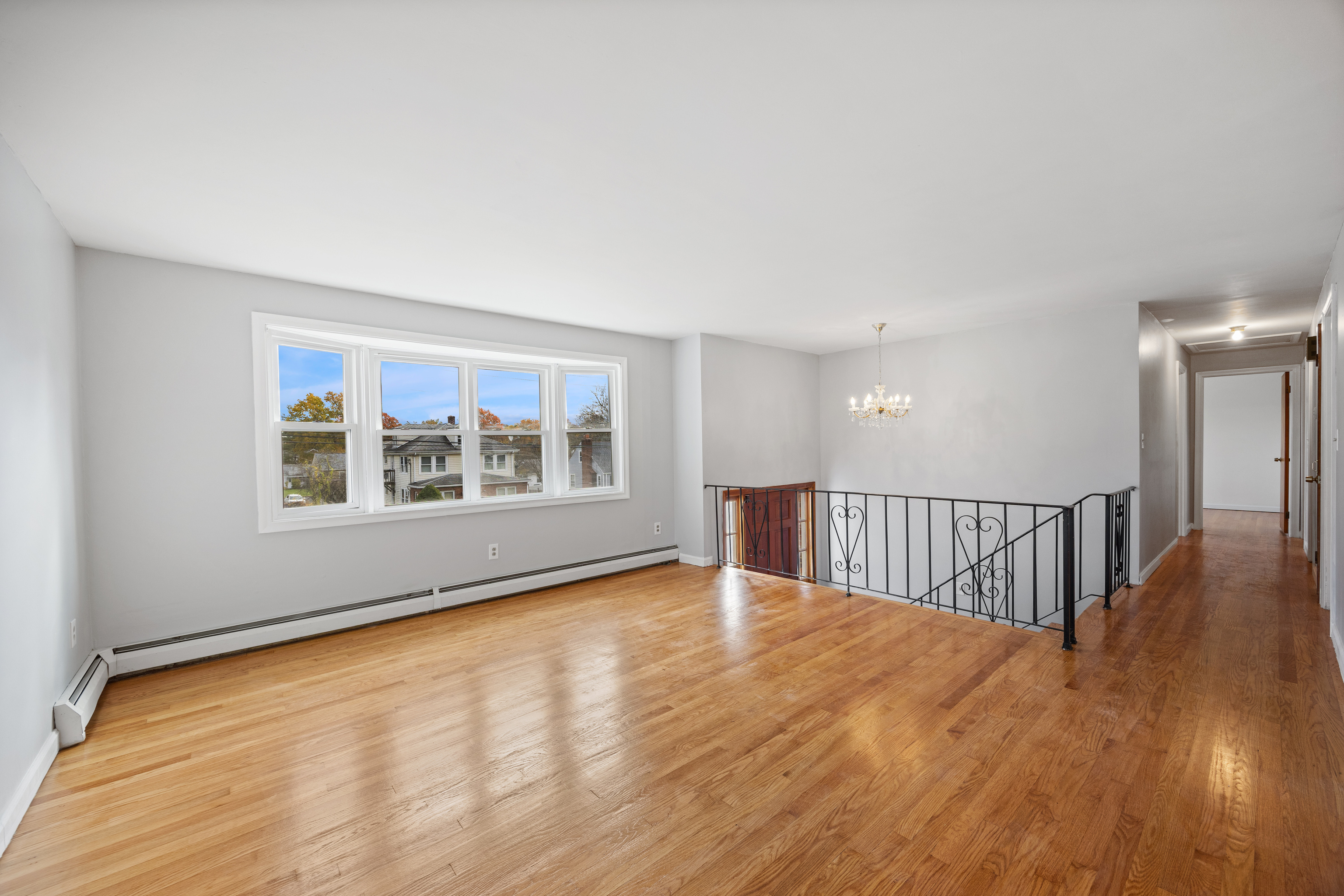 19 Albert Avenue Wethersfield, CT 06109 - Photo 2 of 32 a view of an empty room with wooden floor and a window