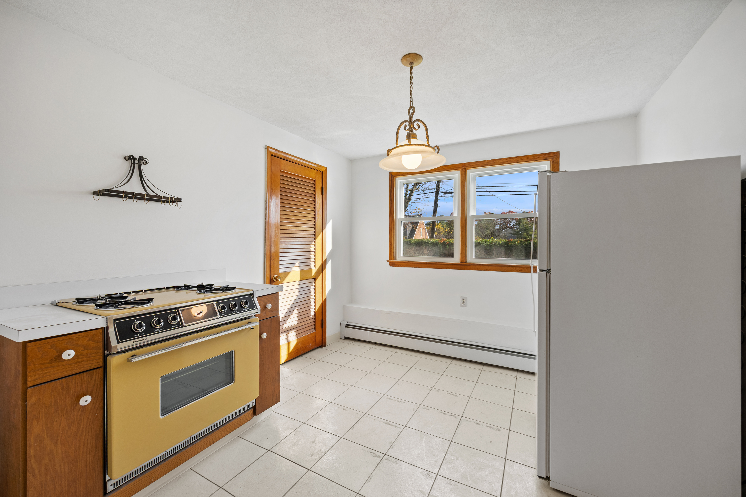 19 Albert Avenue Wethersfield, CT 06109 - Photo 22 of 32 a kitchen with a stove and a refrigerator
