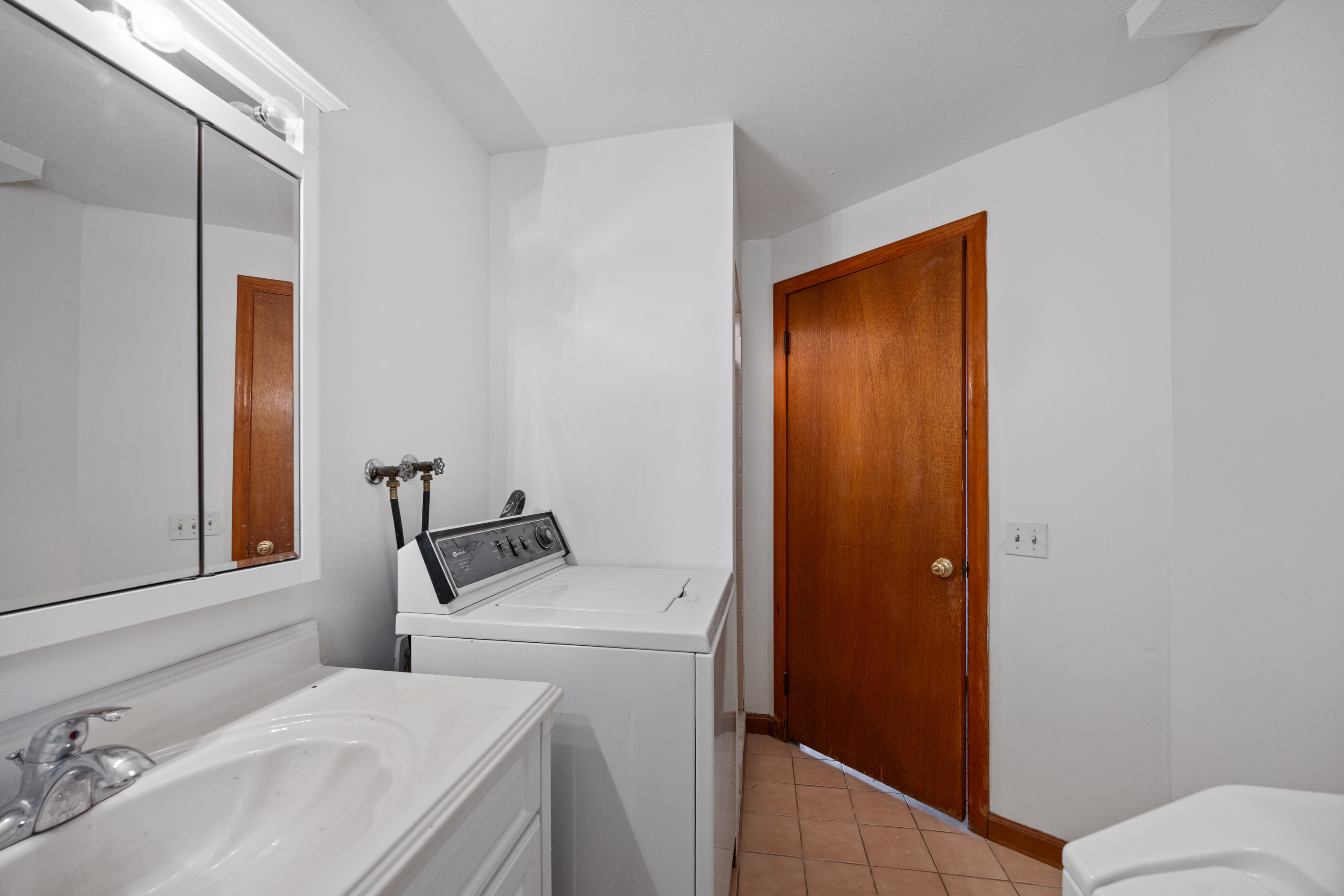 19 Albert Avenue Wethersfield, CT 06109 - Photo 24 of 32 a bathroom with a sink and a mirror