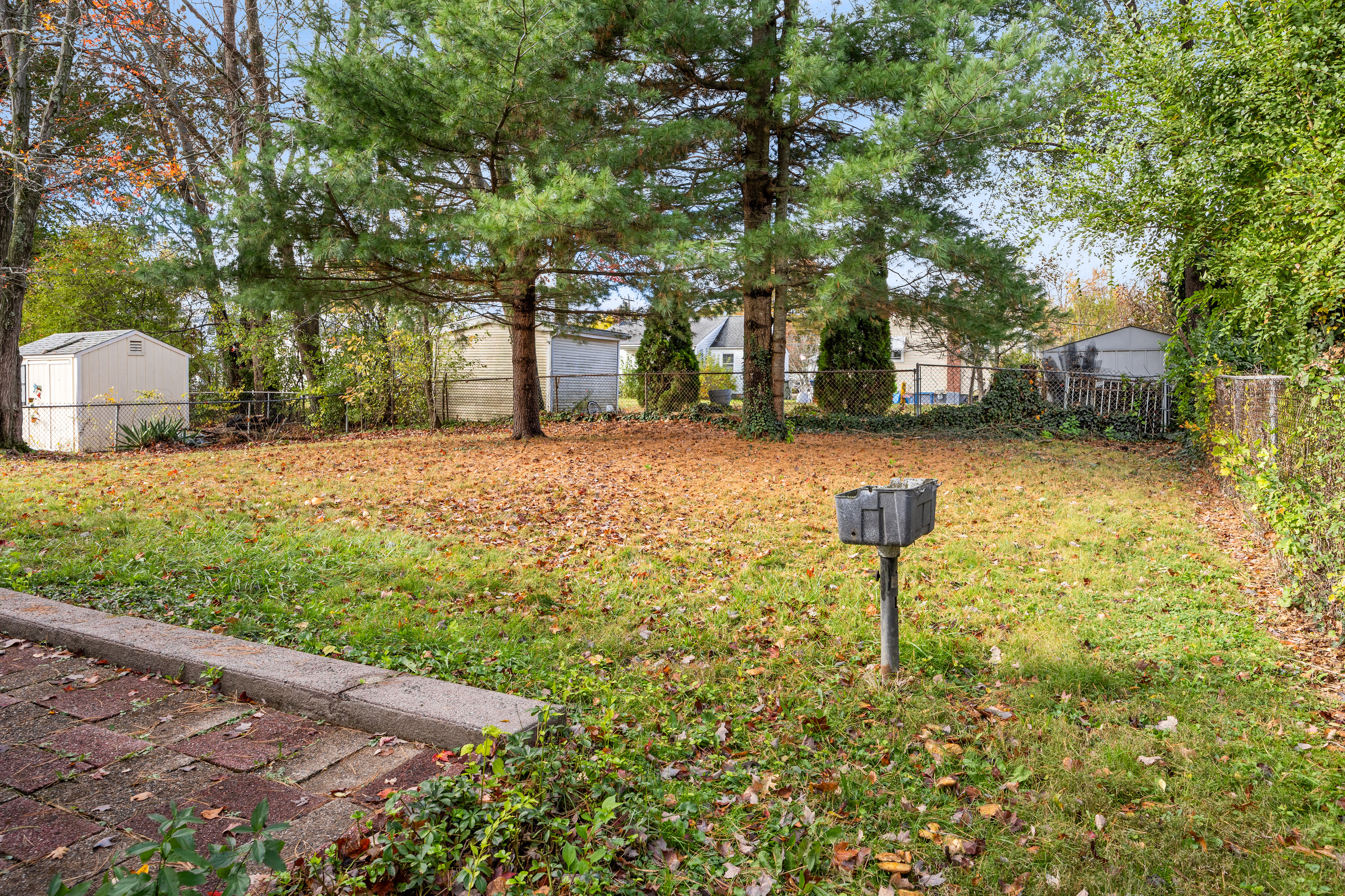 19 Albert Avenue Wethersfield, CT 06109 - Photo 29 of 32 a backyard of a house with table and chairs