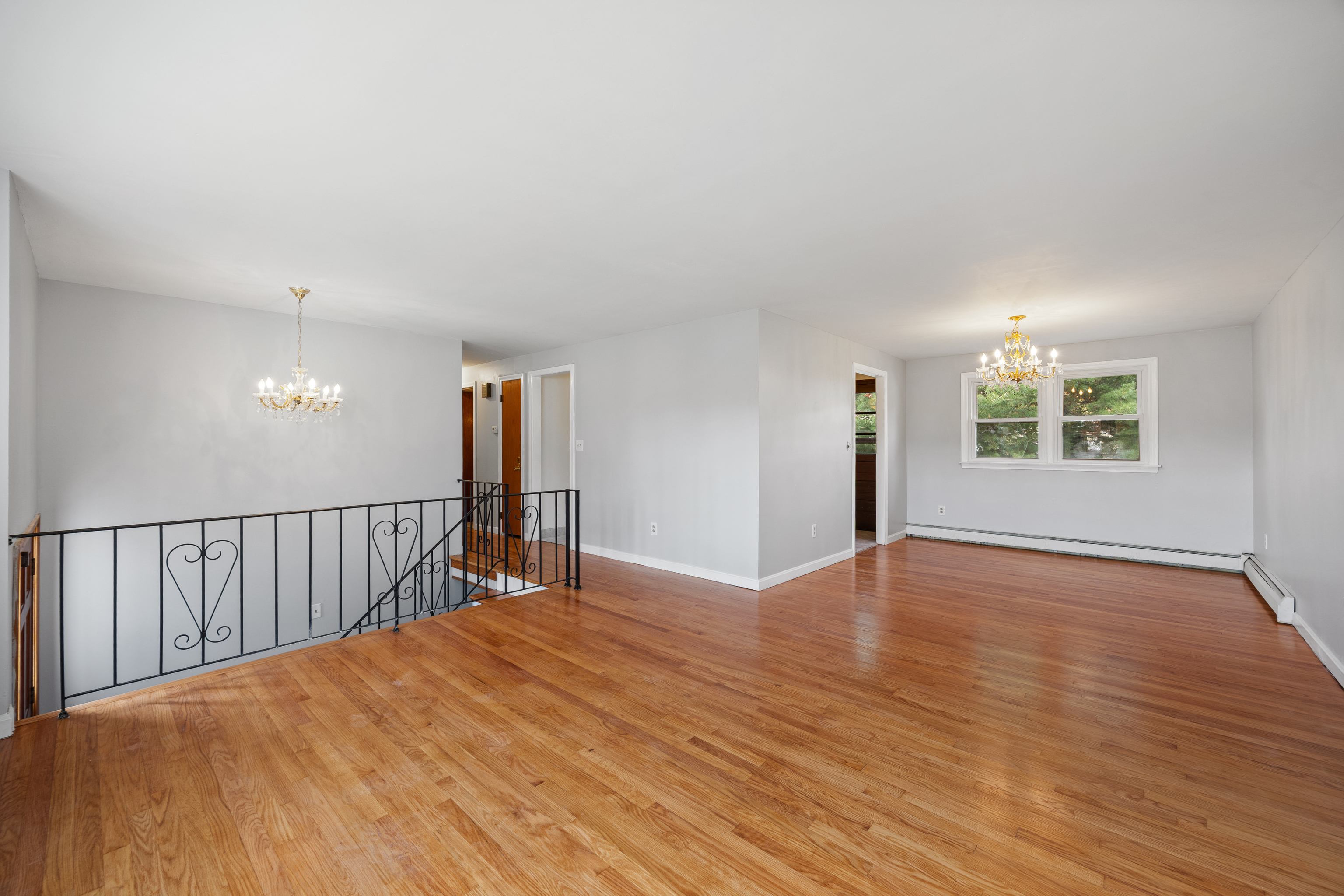 19 Albert Avenue Wethersfield, CT 06109 - Photo 4 of 32 a view of an empty room with wooden floor and a window
