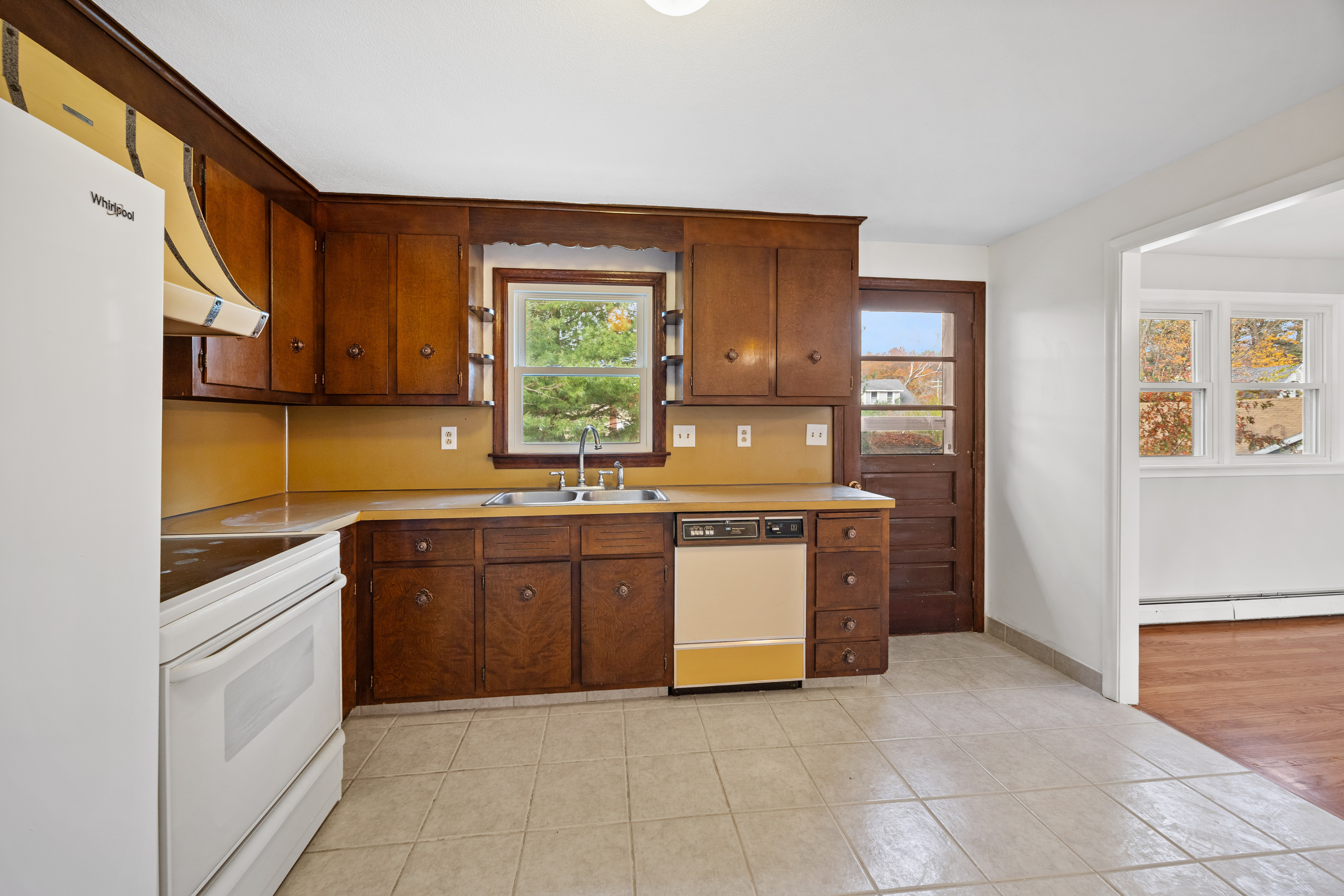 19 Albert Avenue Wethersfield, CT 06109 - Photo 10 of 32 a kitchen with stainless steel appliances granite countertop a stove a sink and a refrigerator