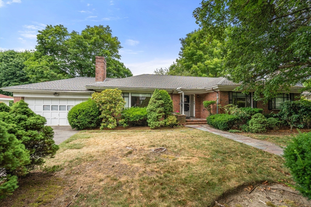 65 Lagrange Street Brookline, MA 02467 - Photo 27 of 39 a front view of a house with a yard