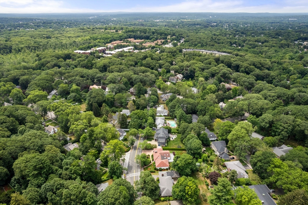 65 Lagrange Street Brookline, MA 02467 - Photo 32 of 39 an aerial view of a houses with a lush green hillside