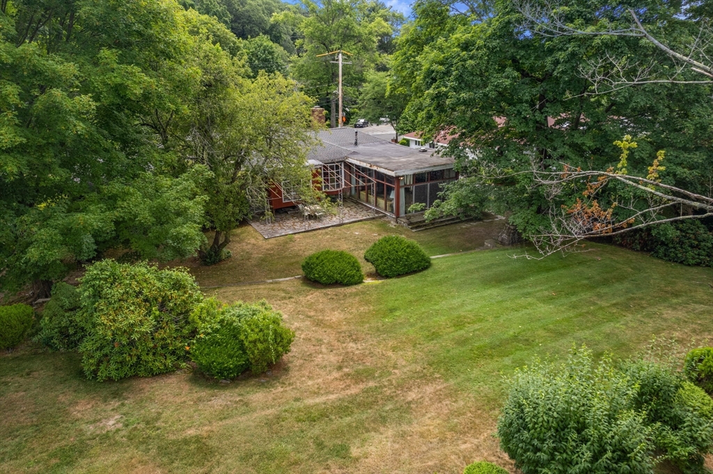 65 Lagrange Street Brookline, MA 02467 - Photo 39 of 39 a backyard of a house with yard and trampoline