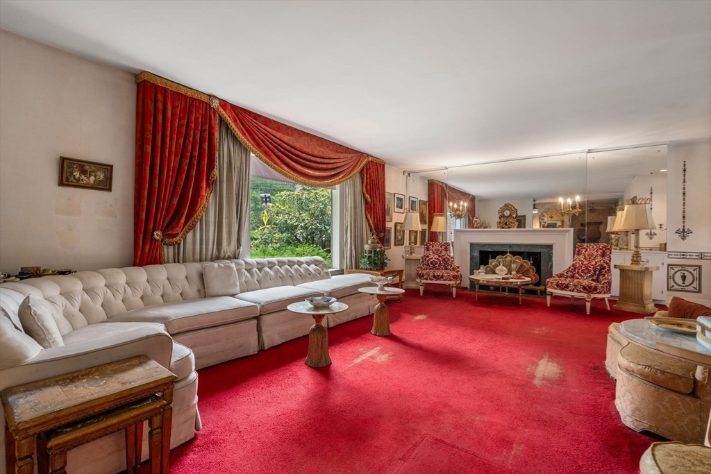 65 Lagrange Street Brookline, MA 02467 - Photo 4 of 39 a living room with furniture and a fireplace