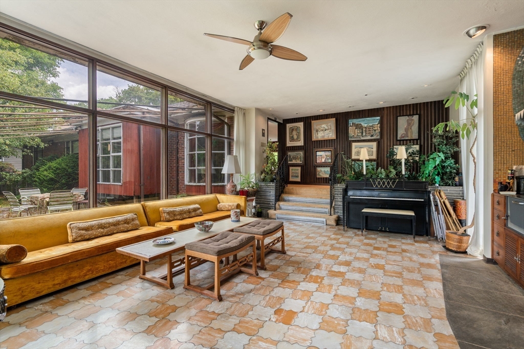 65 Lagrange Street Brookline, MA 02467 - Photo 8 of 39 a living room with furniture and a floor to ceiling window
