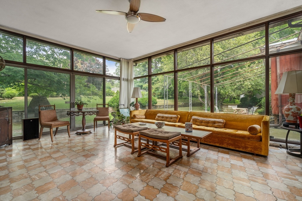 65 Lagrange Street Brookline, MA 02467 - Photo 10 of 39 a living room with furniture and a large window